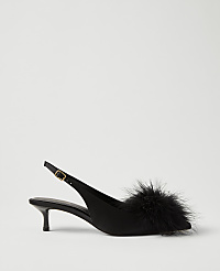 A black satin slingback heel with a fluffy feather pompom on the toe sits against a plain light gray background. carousel Product Image 1