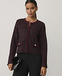 A woman wearing a burgundy tweed jacket and black trousers stands against a plain light gray background. carousel Product Image 1