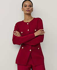 A woman wearing a red buttoned blazer stands with her arms crossed against a plain white background. carousel Product Image 1
