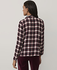 A woman wearing a maroon and white plaid shirt and maroon velvet pants stands against a plain light gray background. carousel Product Image 2