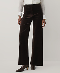 A person wearing a white blouse, dark brown velvet wide-leg trousers, and brown crocodile-patterned boots stands against a plain off-white background. carousel Product Image 2