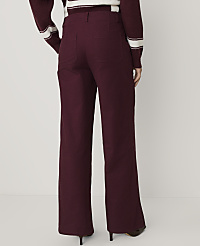 A person wearing burgundy wide-leg trousers and a matching striped sweater stands against a plain white background. carousel Product Image 3