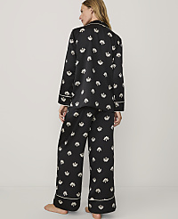 A woman stands with her back to the camera wearing black floral pajamas against a plain white background. carousel Product Image 2
