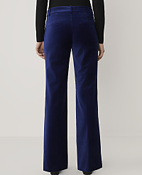 A person wearing a black top and wide-leg royal blue velvet trousers stands against a plain light gray background. carousel Product Image 3
