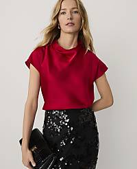 A woman wearing a red satin top and a black sequined skirt stands against a plain white background. carousel Product Image 1