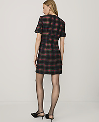 A woman wearing a red and black plaid dress, black tights, and black heels stands against a plain white background. carousel Product Image 2