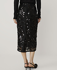 A person wearing a black sequined midi skirt and black heels stands against a plain white background. carousel Product Image 3