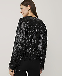 A woman wearing a black sequined fringe jacket and black pants stands against a plain light gray background. carousel Product Image 2