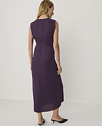 A woman wearing a sleeveless purple midi dress and black heels stands against a plain white background. carousel Product Image 2