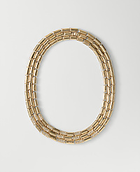 A gold link necklace with diamond accents rests on a plain white background. carousel Product Image 1