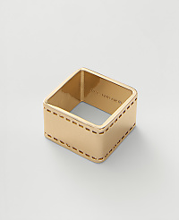 A gold-toned square ring with film strip perforations sits centered on a plain light gray background. carousel Product Image 1