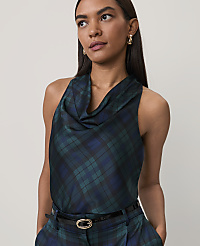 A woman wearing a dark green and blue plaid cowl-neck top and matching trousers stands against a plain, light-colored background. carousel Product Image 2