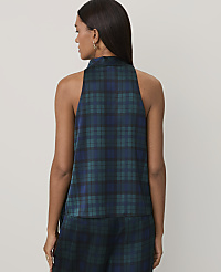 A woman wearing a dark green and blue plaid sleeveless top and matching pants stands against a plain, light-colored background. carousel Product Image 3