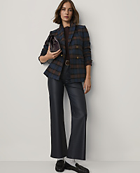 A woman wearing a plaid blazer and navy leather trousers stands against a plain white background. carousel Product Image 3