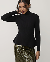 A woman wearing a black ribbed peplum sweater and a gold sequined skirt stands against a plain light gray background. carousel Product Image 1