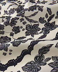 Dark navy floral patterns and scalloped borders are printed across a draped, off-white fabric. carousel Product Image 2
