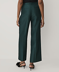 A person wearing dark green wide-leg trousers and black feathered heels stands against a plain white background. carousel Product Image 3