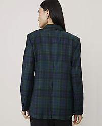 A woman wearing a green and blue plaid blazer stands with her back to the camera against a plain, light-colored background. carousel Product Image 2