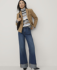 A woman wearing a tan blazer, a striped turtleneck, and wide-leg jeans stands against a plain white background. carousel Product Image 3