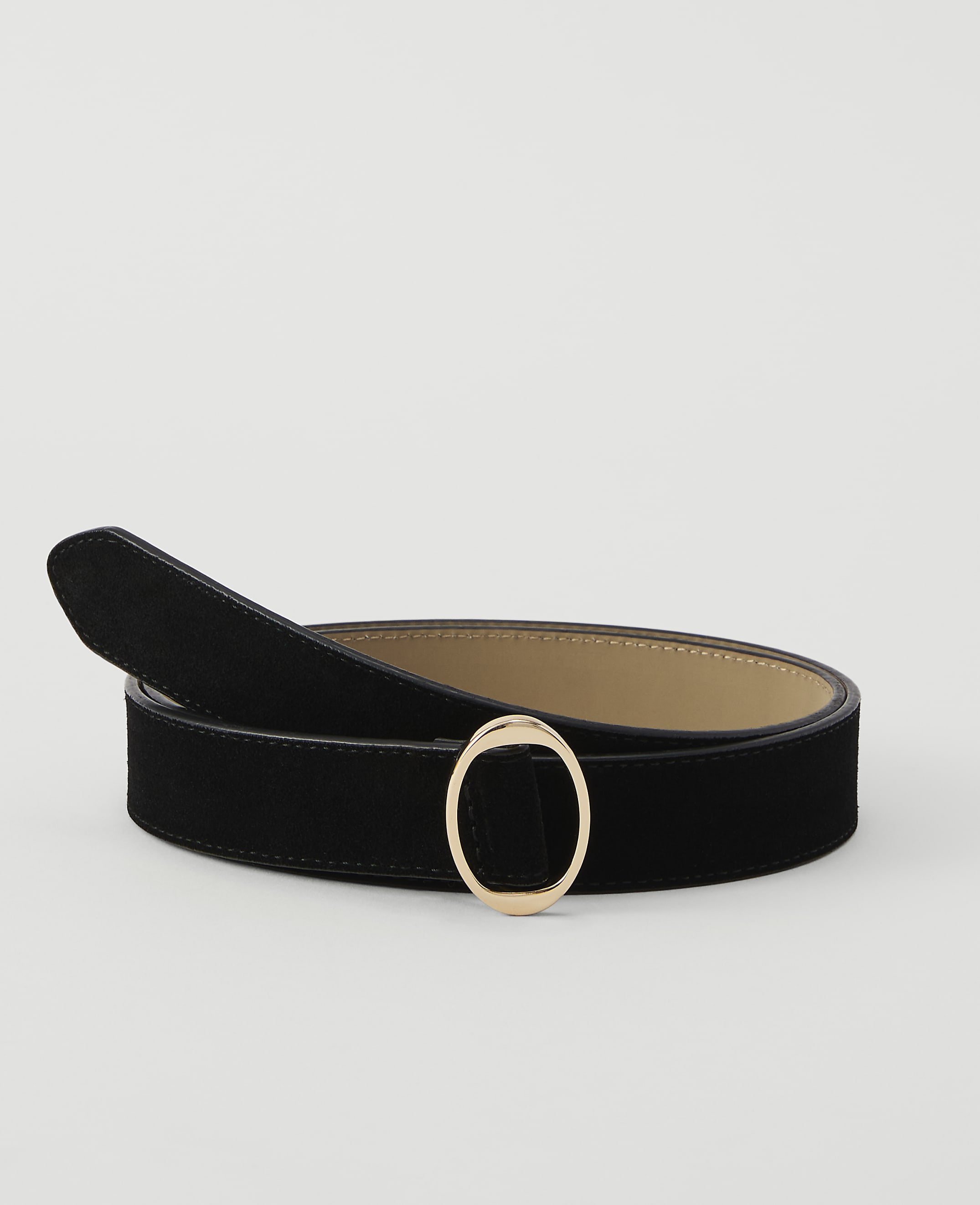 A black suede belt with a gold oval buckle lies on a plain white background.