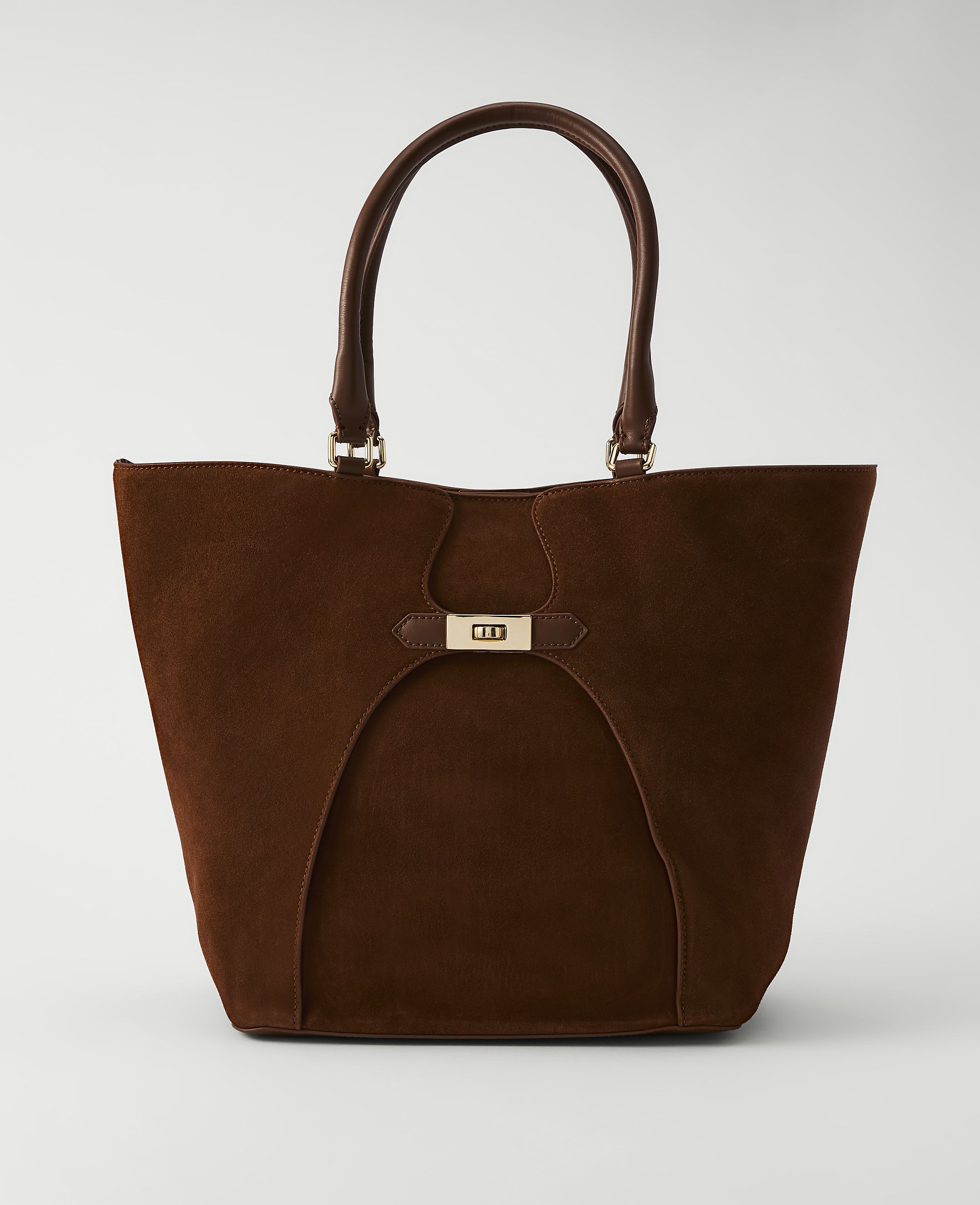 A rich brown suede tote bag with leather handles and a gold clasp sits against a plain white background.