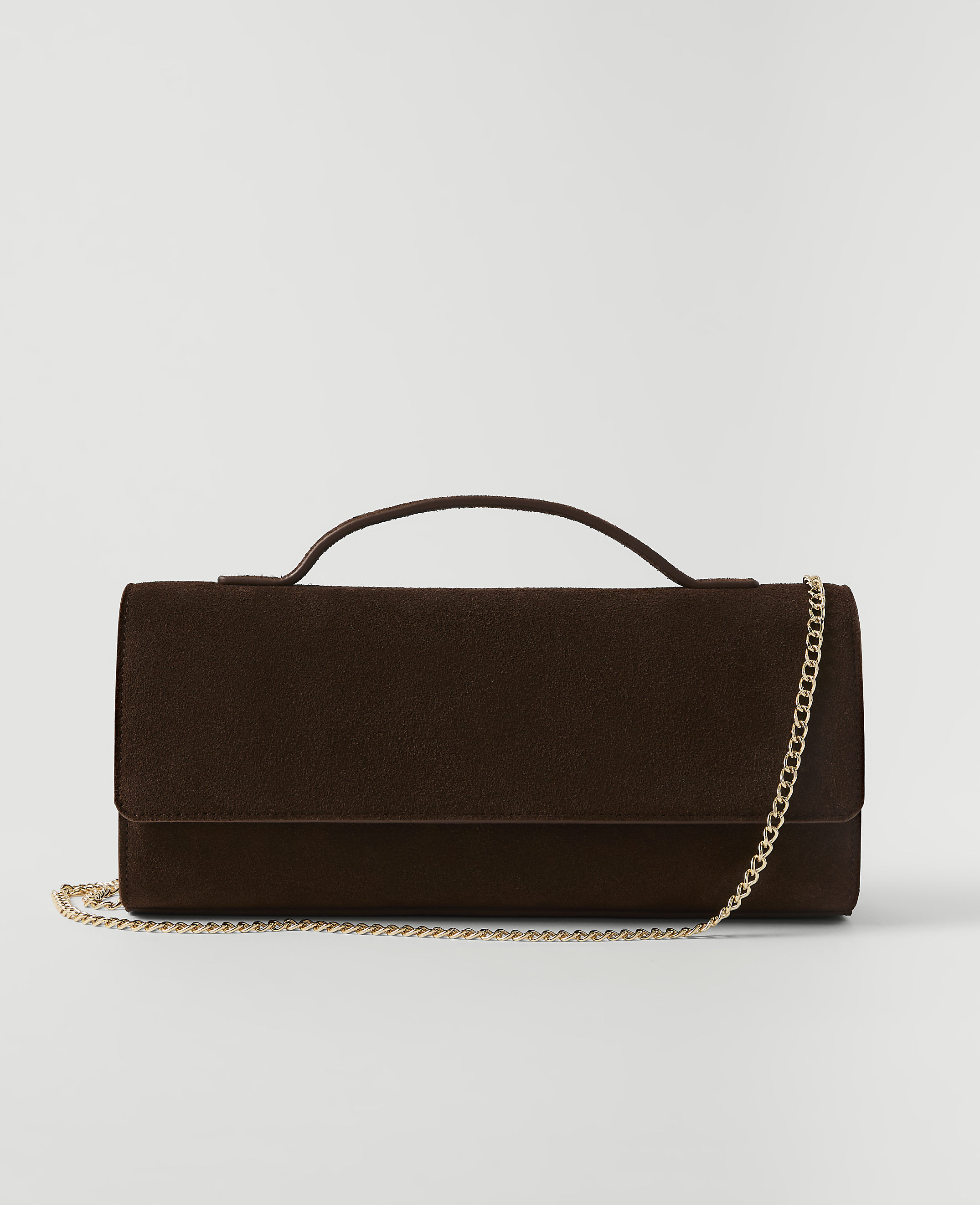 A dark brown textured clutch with a gold chain strap rests on a plain white background.