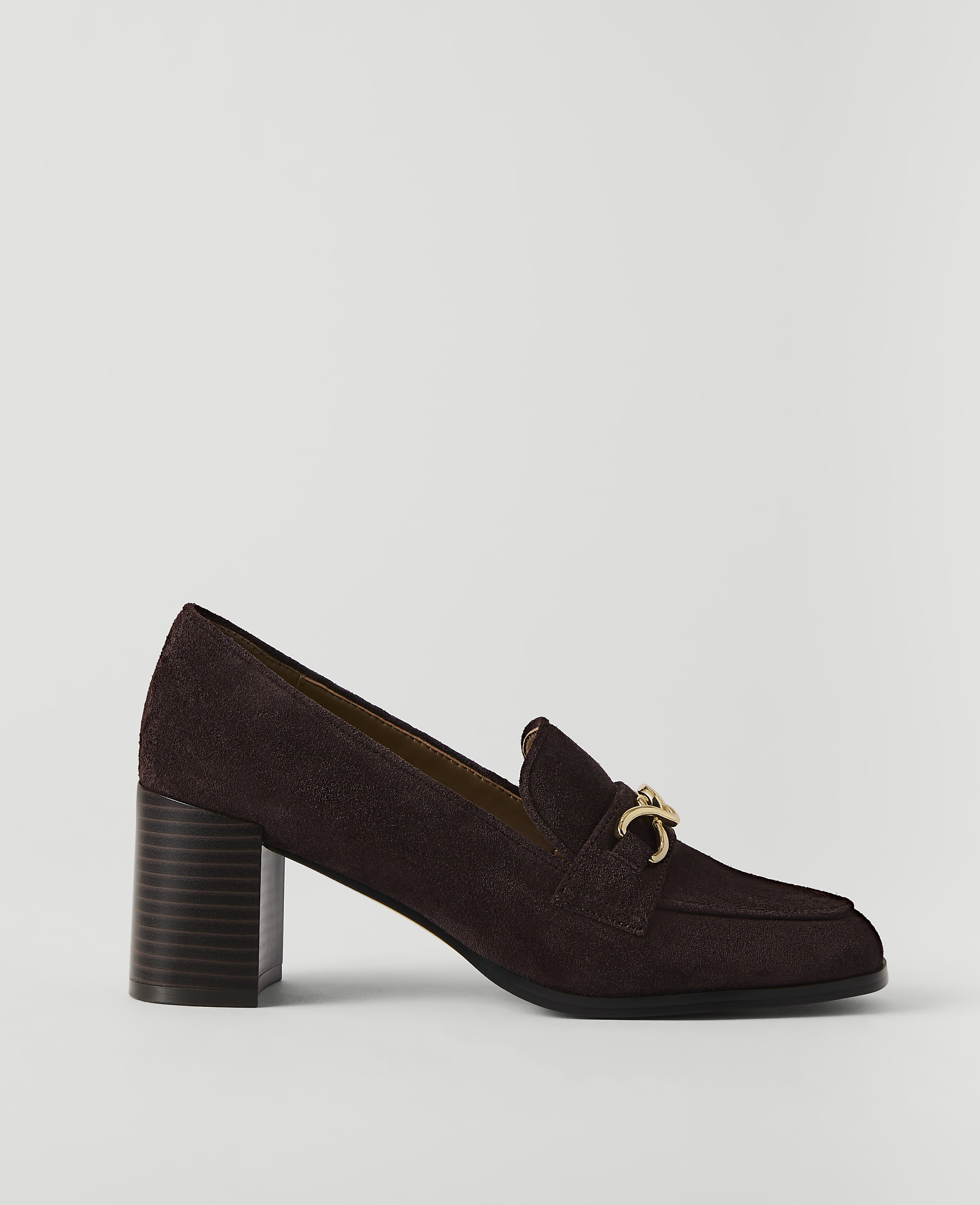 A dark brown suede loafer with a gold buckle sits on a plain white background.