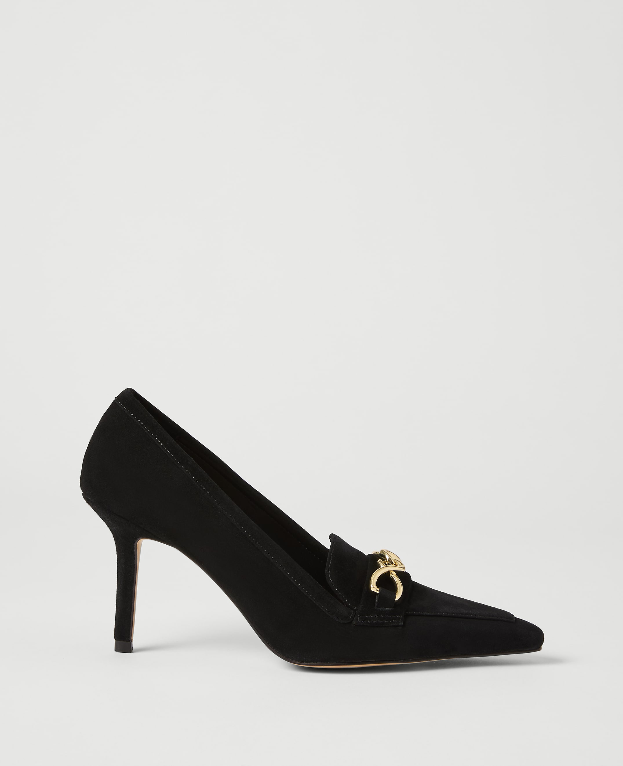 A black suede pump with a gold horsebit detail rests on a plain white background.