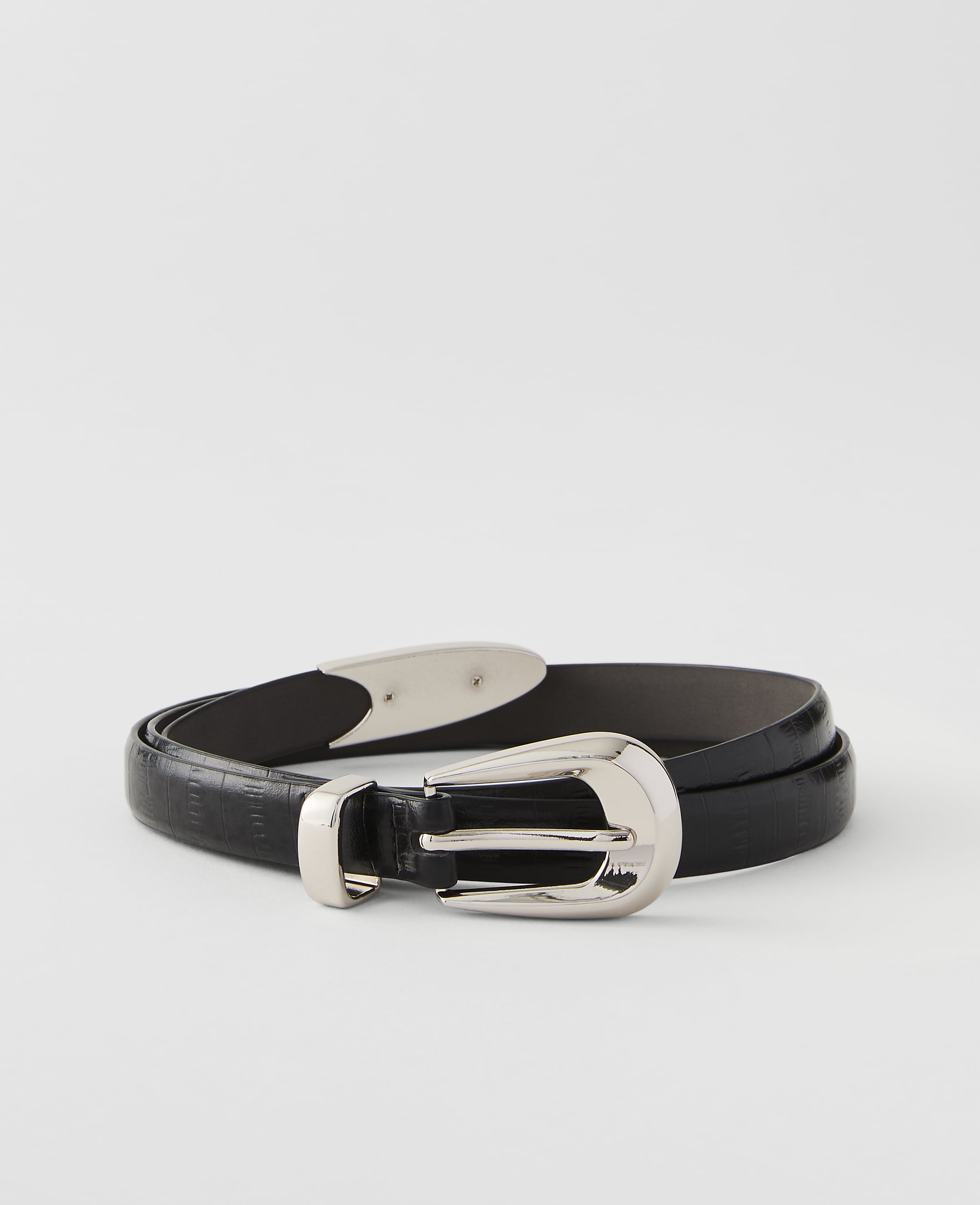 A black textured leather belt with a silver buckle rests on a plain white background.