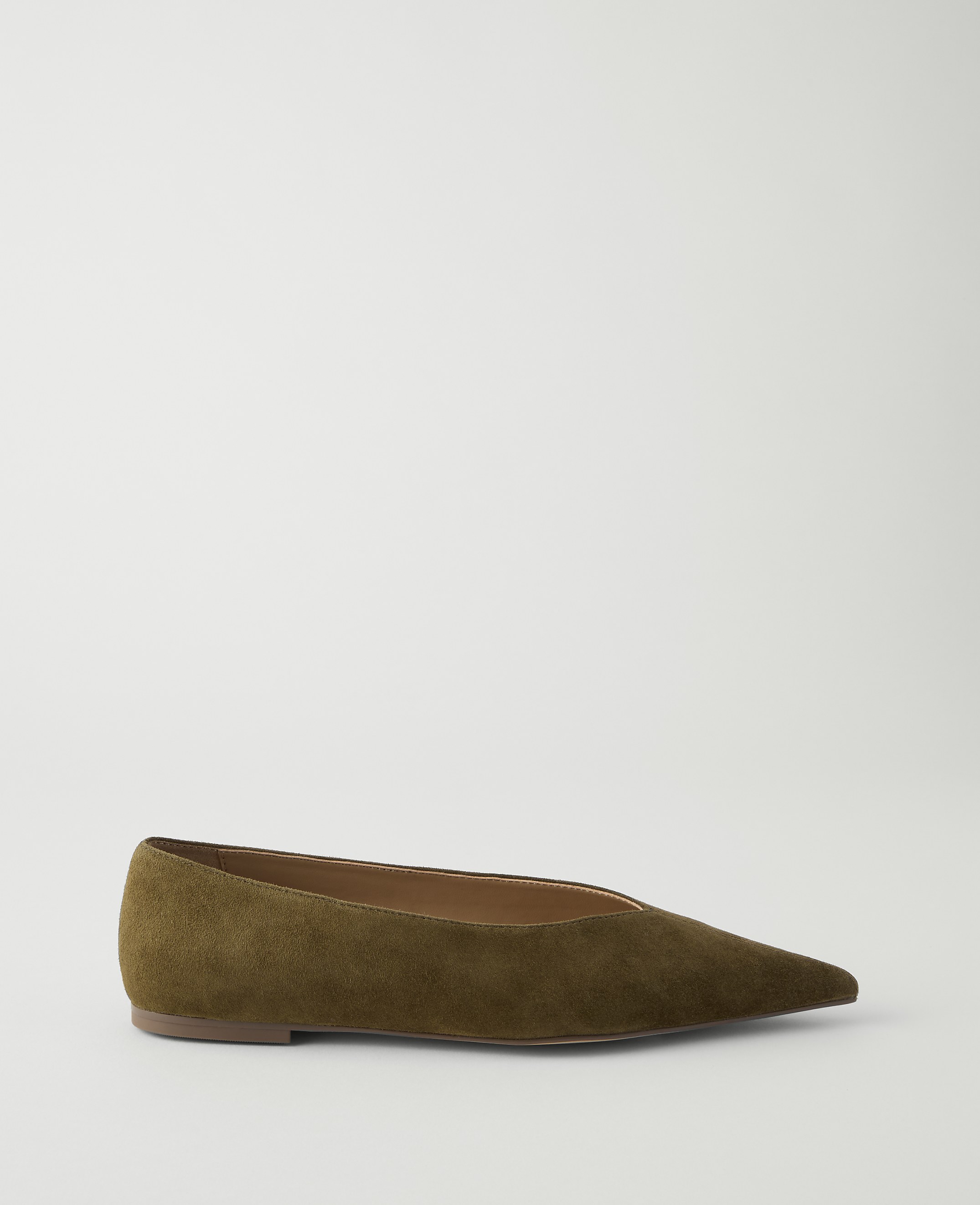 A single olive green pointed-toe flat shoe rests on a plain white background.