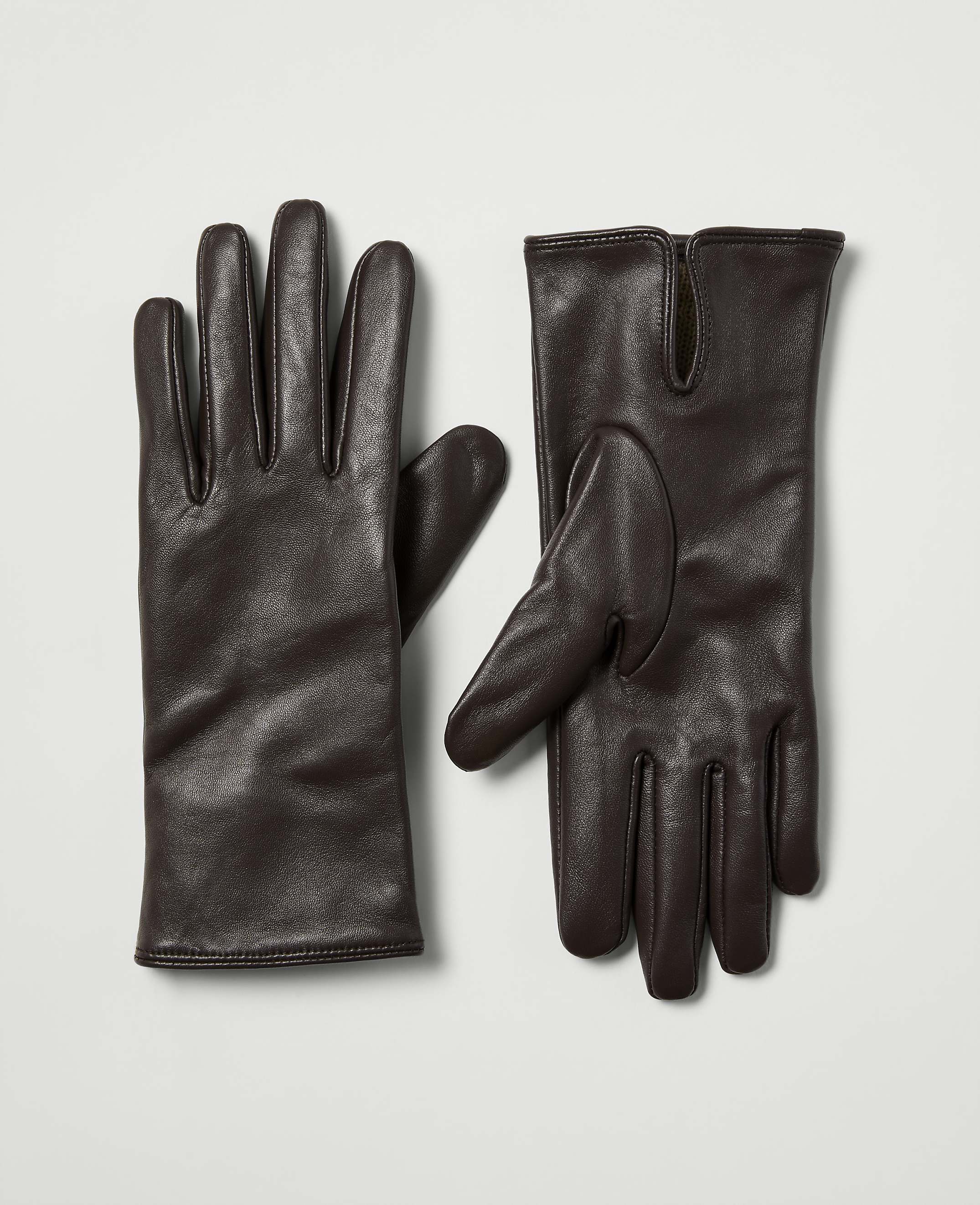 A pair of dark brown leather gloves lies on a plain, light gray background.