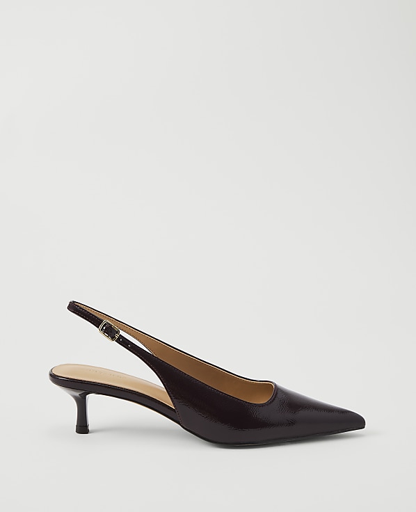 A glossy, dark brown slingback kitten heel rests on a plain white background.