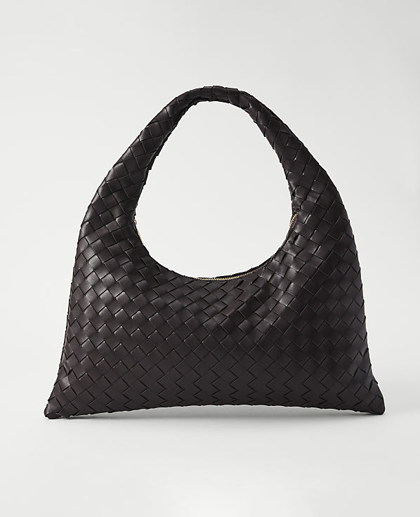 A dark brown woven leather hobo bag rests on a plain white background.