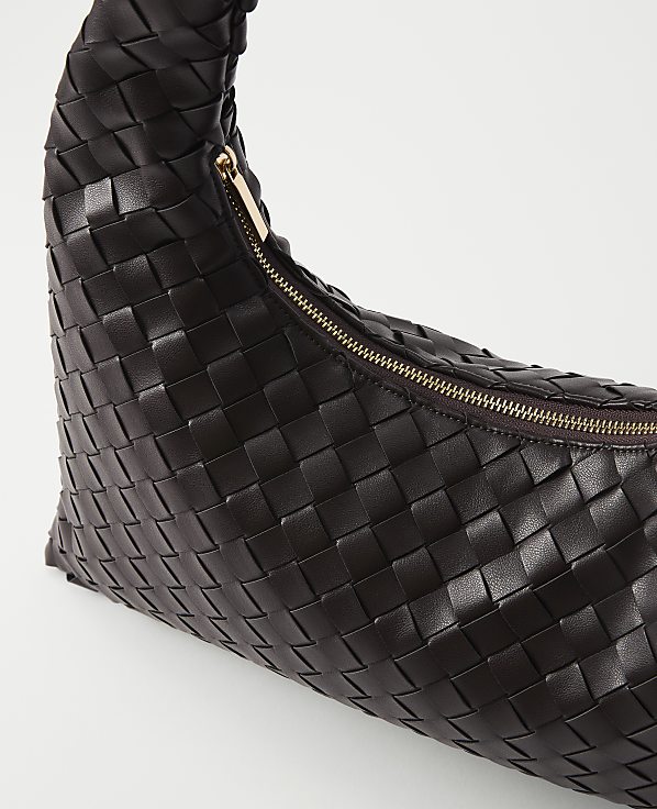 A dark brown woven leather handbag with a gold zipper is presented against a plain white background.