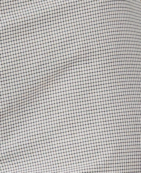 A close-up view of a white fabric with a fine, dark grid pattern fills the frame, with subtle wrinkles creating soft shadows across the textured surface.