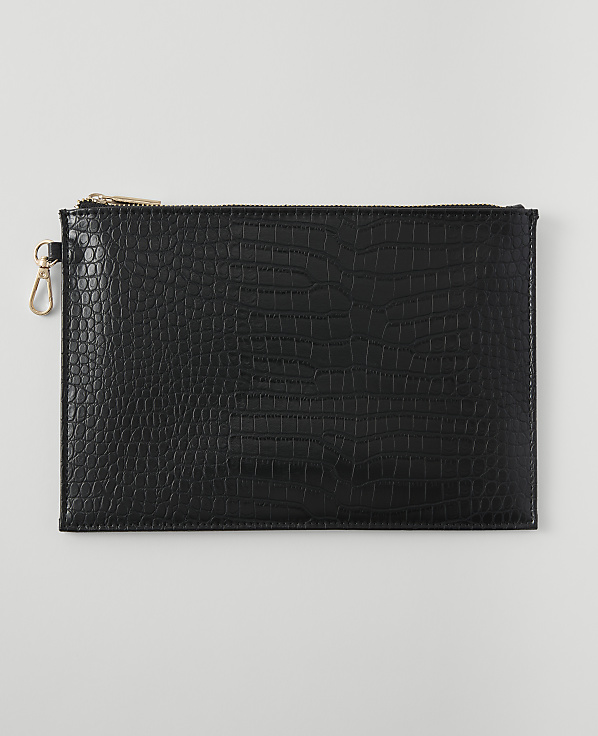 A black embossed clutch with a gold zipper and clasp rests on a plain white background.