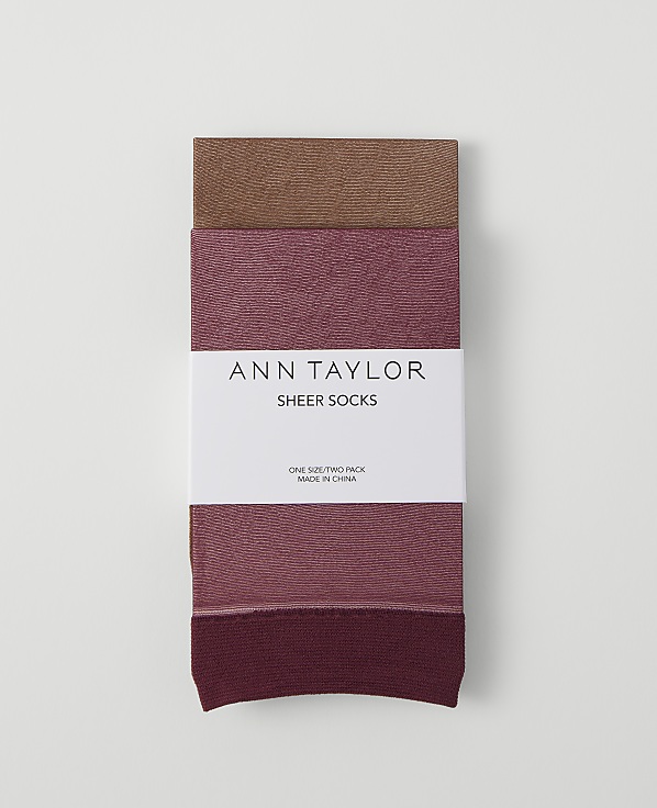 A pack of three Ann Taylor sheer socks in varying shades of brown and pink is laid flat against a plain white background.