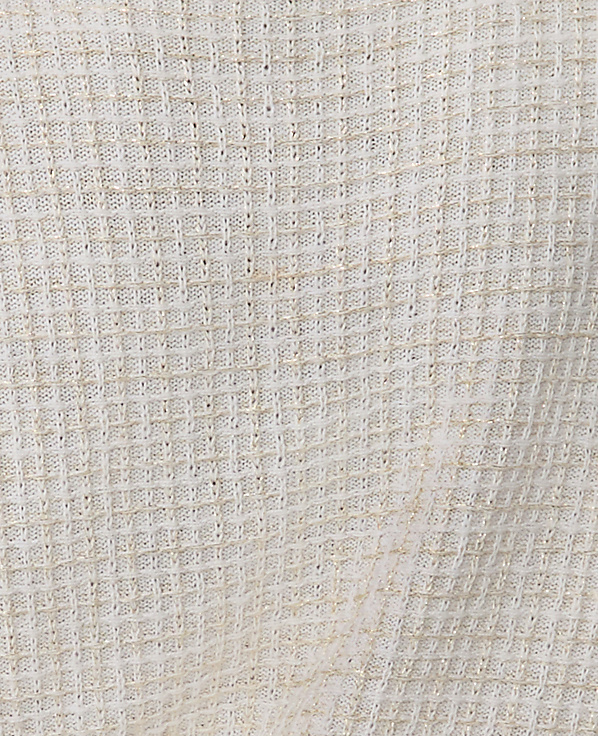 A close-up of a white, textured grid-patterned fabric fills the entire foreground and background.