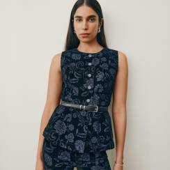 Woman in a matching jacquard vest and skirt set