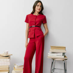 Woman in a red short-sleeve top and matching red trousers