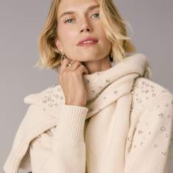 Woman in an ivory embellished cardigan