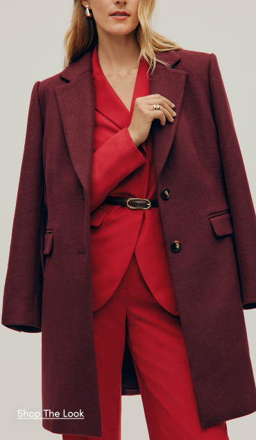 The Outerwear Shop — a woman in a burgundy overcoat over a bright red pantsuit. Shop the Look.