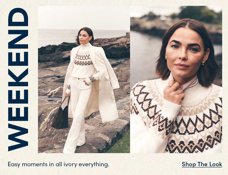 Easy moments in all ivory everything — woman in an ivory sweater and white coat on a rocky coast. Shop the Look.
